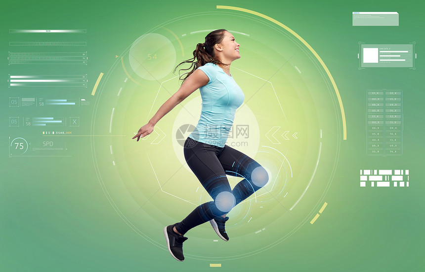 运动,健身,技术人的快乐的微笑轻女人空中跳跃白色的背景快乐微笑运动的轻女人空中跳跃图片