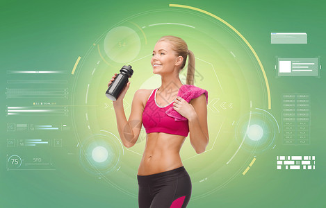 健身,运动,锻炼,减肥人的微笑的运动女与瓶水毛巾绿色背景带着瓶水毛巾的运动女人图片