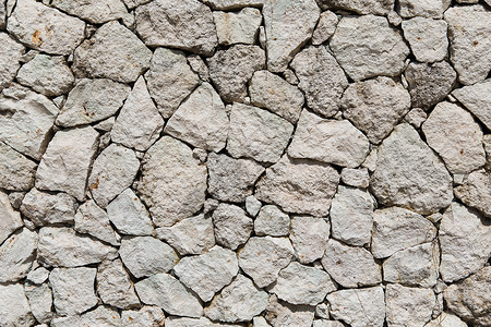 白垩石颗粒状的石材,砌体,背景纹理粒状石墙石墙纹理背景