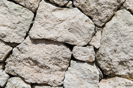 白垩石颗粒状的石材,砌体,背景纹理粒状石墙石墙纹理背景