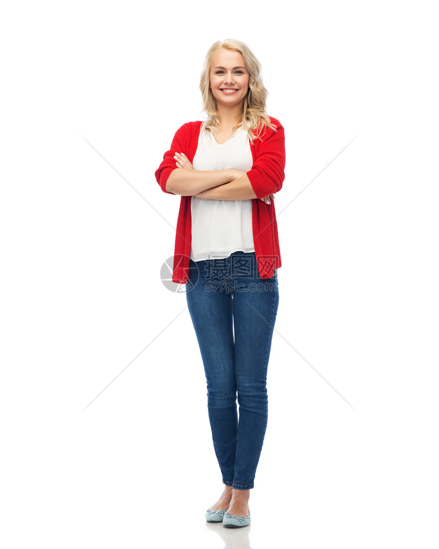 时尚,肖像人的快乐微笑的轻女人穿着红色开衫牛仔裤穿着红色开衫的快乐微笑的轻女人穿着红色开衫的快乐微笑的轻图片
