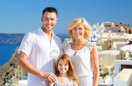 旅游,旅游人的幸福的家庭桑托里尼岛的背景桑托里尼岛背景下的幸福家庭图片