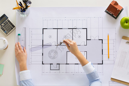 分隔符素材商业,建筑,建筑建筑建筑师手与指南针测量蓝图的客厅办公室办公室用指南针测量蓝图背景