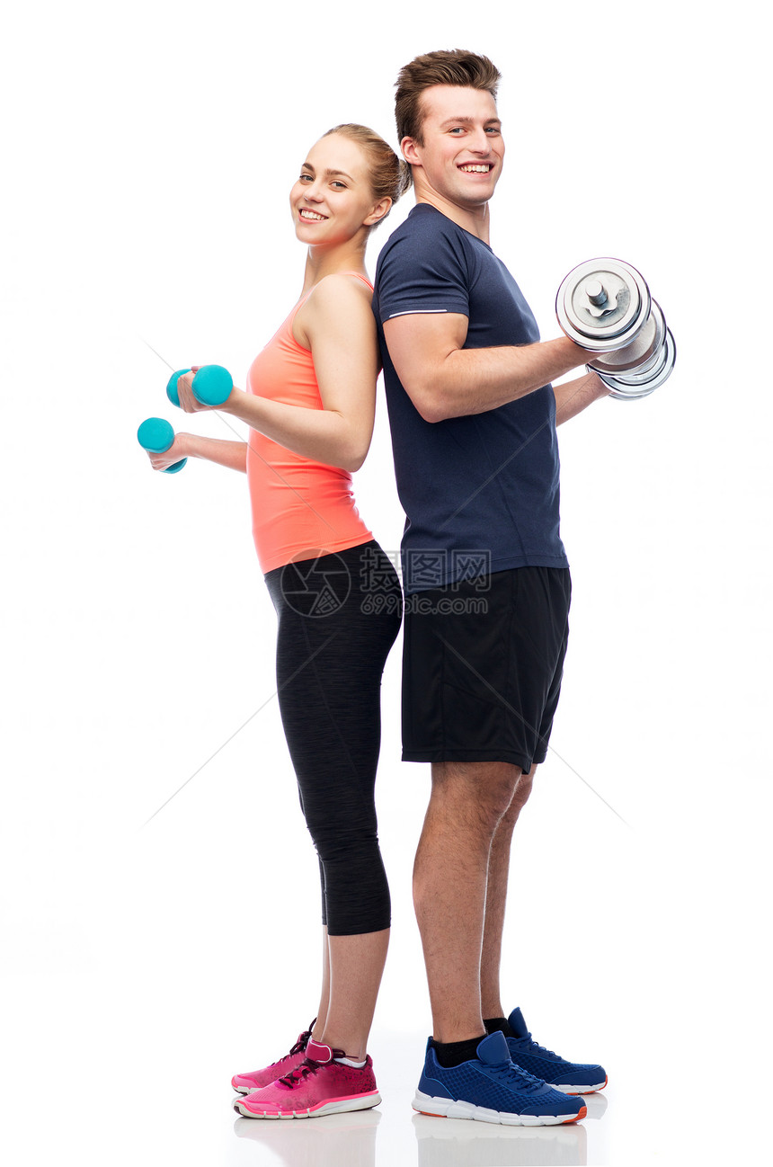 运动,健身,生活方式人们的快乐运动的男人女人哑铃弯曲肌肉哑铃的男男女女图片
