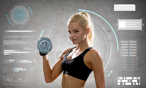 健身,运动人的轻的运动女运动与钢哑铃灰色背景轻的运动女用钢哑铃锻炼图片