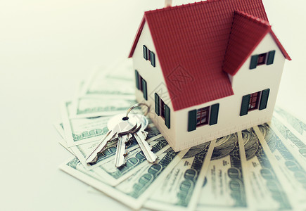 抵押贷款,投资,房地产财产家庭模式,美元货币房屋钥匙家庭模型,钱房子钥匙背景图片