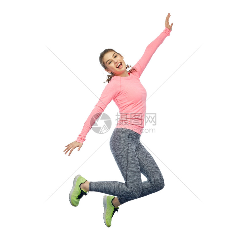 运动,健身,运动人的快乐的微笑轻女人空中跳过白色的背景快乐微笑运动的轻女人空中跳跃图片