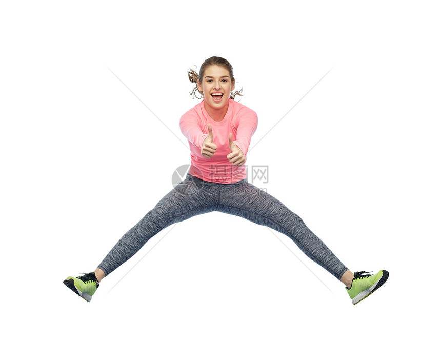 运动,健身,运动人的快乐的微笑轻女子跳空中的白色背景竖大拇指快乐微笑运动的轻女人空中跳跃图片