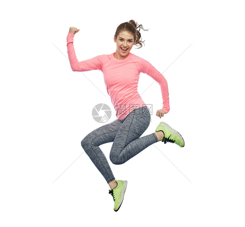 运动,健身,运动人的快乐的微笑轻女人空中跳跃,并白色背景上力量姿态快乐微笑运动的轻女人空中跳跃图片