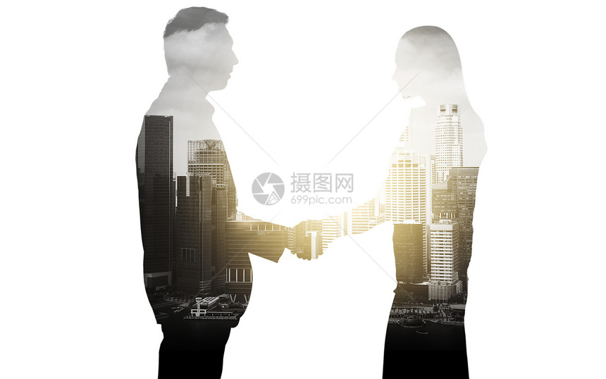 商业伙伴关系合作商人女商人的剪影城市背景上握手商人城市背景下握手图片