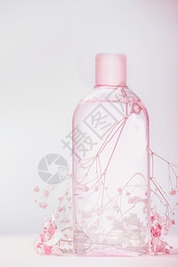 瓶子与乳液,滋补胶清洁水,天然化妆品美容粉彩背景,正视图图片