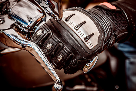 凯夫拉尔人的手摩托车赛车手套持摩托车油门控制手保护免受跌倒事故背景