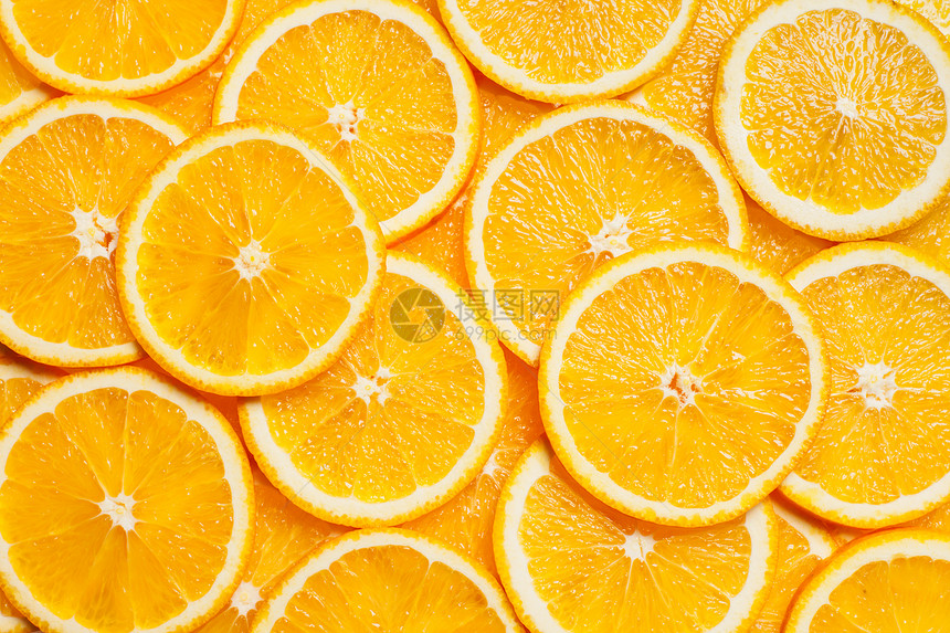彩色橙色柑橘类水果片背景顶部视图五颜六色的橙色水果片图片