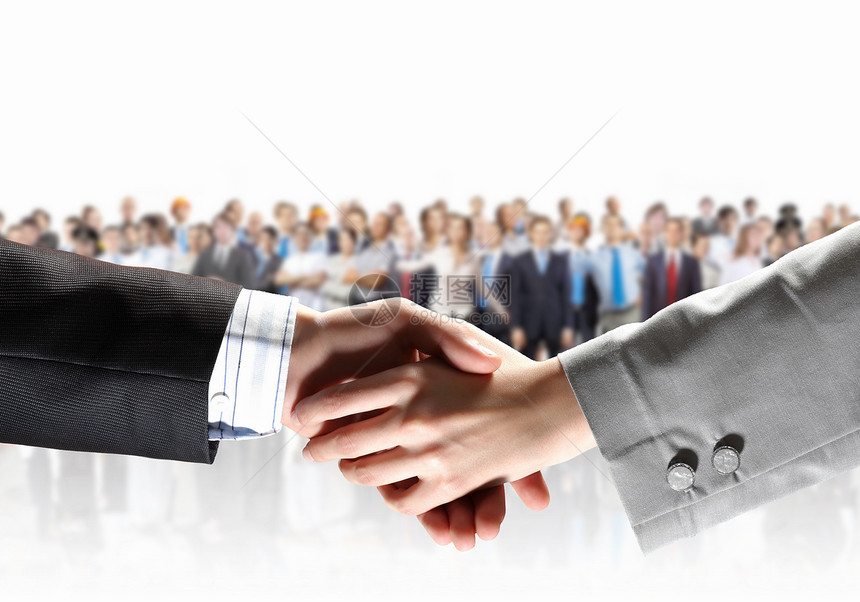 商务握手商务人士与背景下的人握手图片