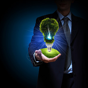 清洁能源绿色灯泡商人灯泡绿色能源的象征图片
