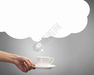 咖啡休息时间紧紧地握住白色的茶咖啡图片