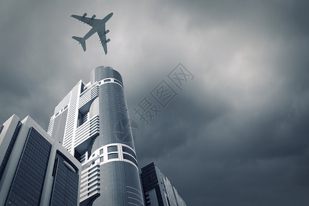 飞行飞机飞机摩天大楼上方飞行的底部视图图片