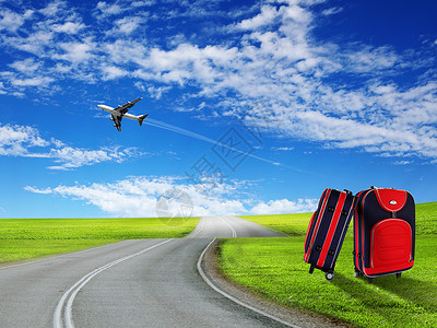 霍尔德尔蓝色天空中的红色手提箱飞机背景