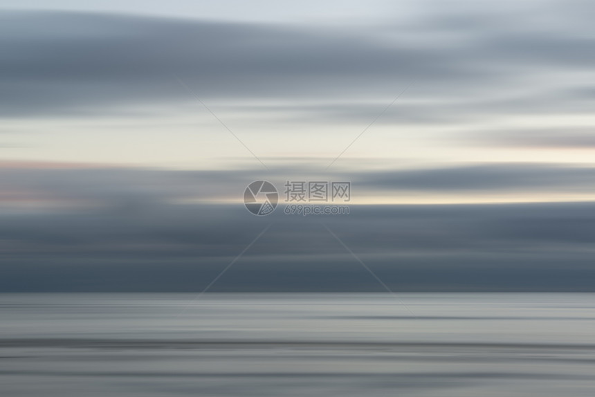 日落时海洋运动的景观图像图片