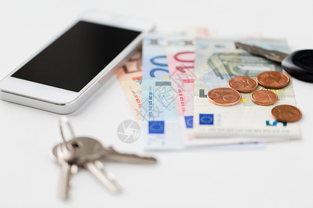 个人物品物品智能手机,欧元货币钥匙桌子上图片
