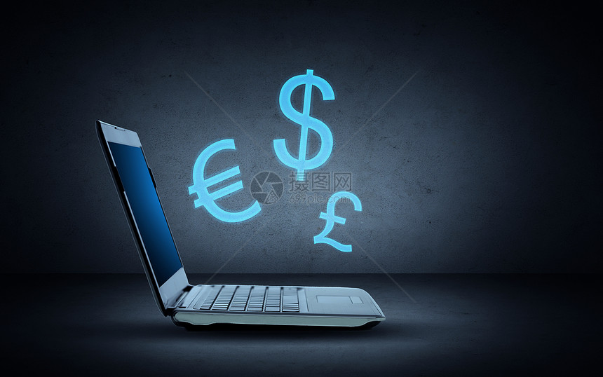 技术,财务汇率打开笔记本电脑与蓝色照明货币符号深灰色背景图片