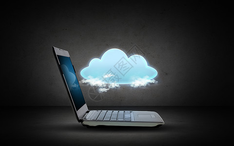 技术,云计算数据传输开放的笔记本电脑与云投影深灰色背景图片