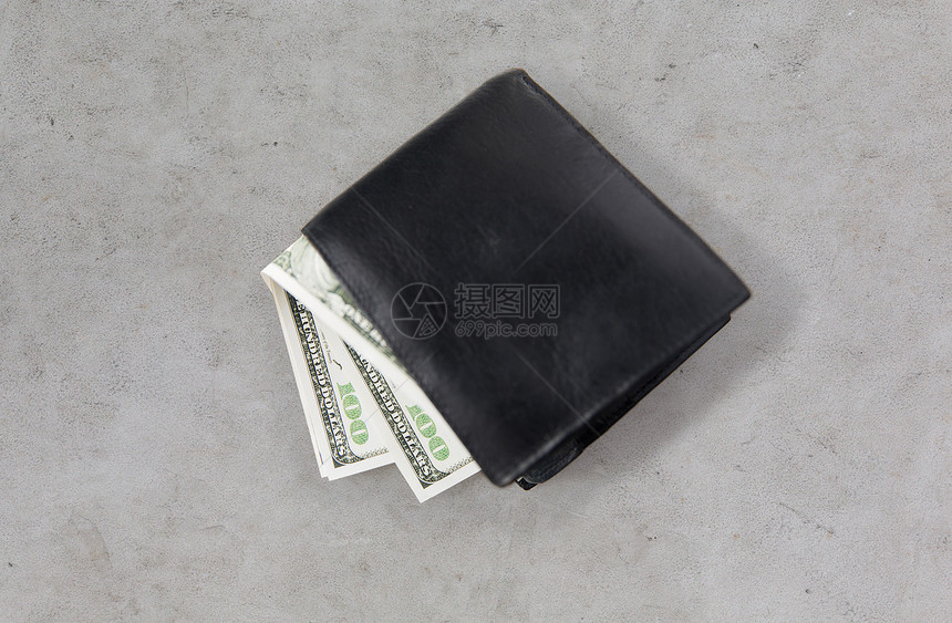 金融投资储蓄现金灰色混凝土桌子上的钱包元货币图片