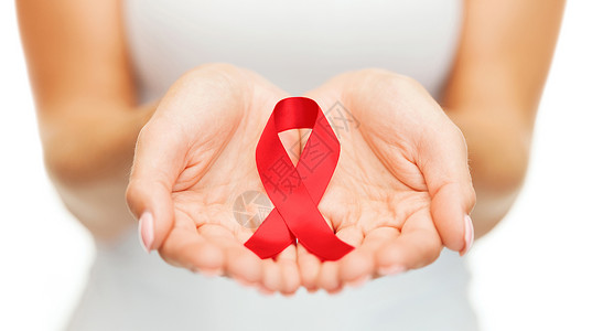 保健医学女手握红色艾滋病意识丝带手红色艾滋病意识丝带图片