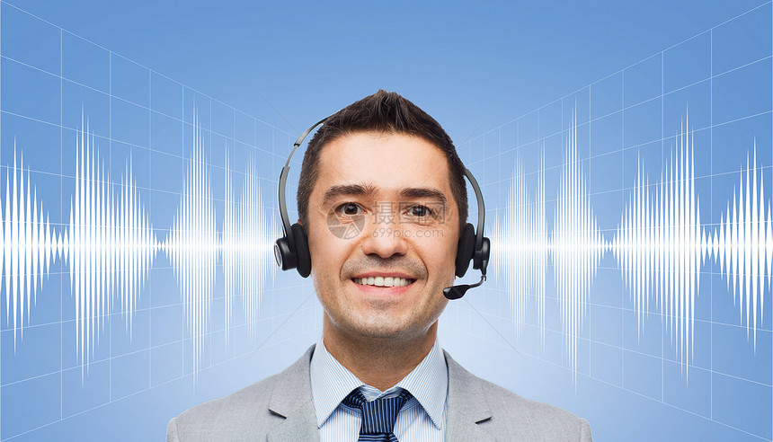 商业,人,技术服务微笑商人耳机声波信号图蓝色背景图片