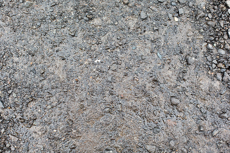 背景纹理湿灰色砾石道路地潮湿的灰色砾石路地图片