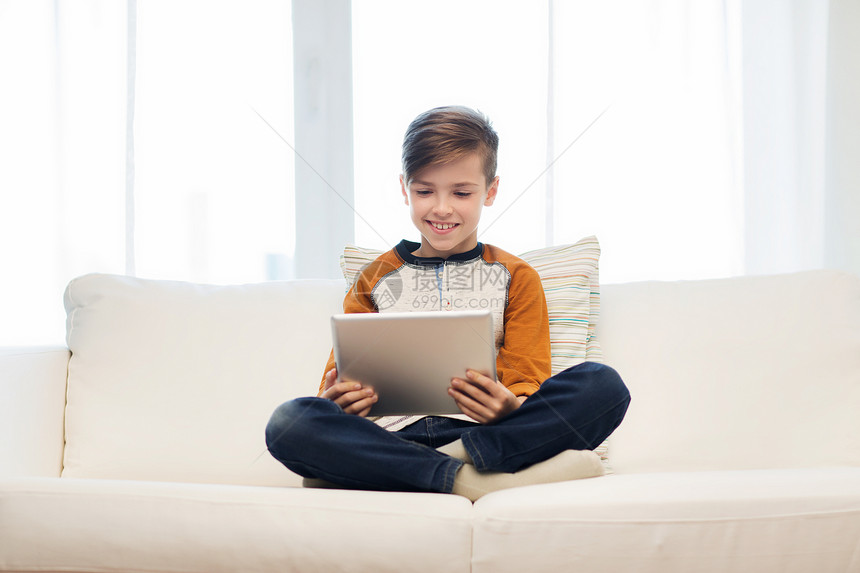 休闲,儿童,技术人的微笑男孩与平板电脑家里图片
