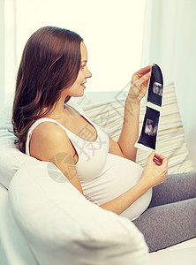 怀孕,母亲,人医学的快乐的孕妇家里看超声波图像图片