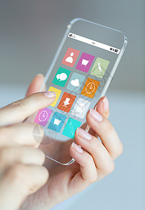 应用icon商业,技术人的近距离的女手握透明的智能手机与应用图标屏幕上背景