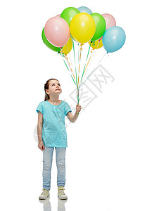 童,时尚,想象力人的快乐的小女孩抬头看着,手里着堆五颜六色的氦气球图片
