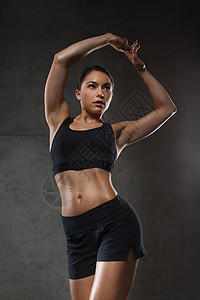 运动,健身,健美,举重人的轻的女人健身房摆姿势展示肌肉图片