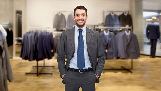 商业,人,男装,销售服装快乐的轻商人的服装店背景图片