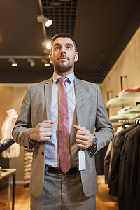 销售,购物,时尚,风格人的轻人商人服装店试衣图片