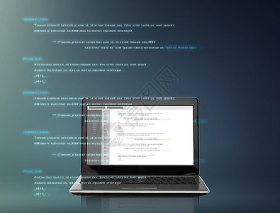 技术编程笔记本电脑与编码屏幕上的灰色背景屏幕上编码的笔记本电脑图片