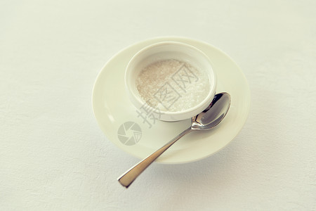 甜味剂,碳水化合物,饮食健康的饮食糖碗碟子与勺子桌子上背景图片