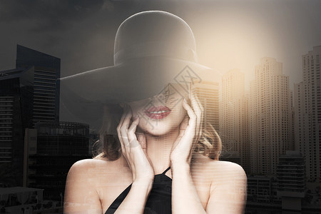 人,豪华时尚的美丽的女人戴着黑色帽子迪拜城市与双重曝光背景图片