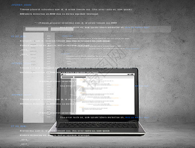 技术编程笔记本电脑与编码屏幕上的灰色混凝土背景屏幕上编码的笔记本电脑图片