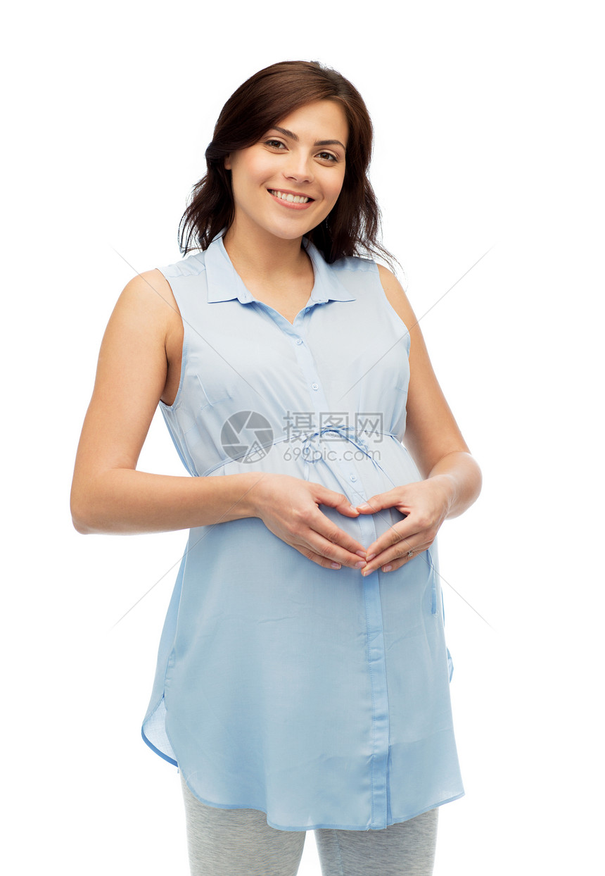 怀孕,爱,人期望快乐的孕妇白色背景下腹部心脏手势图片