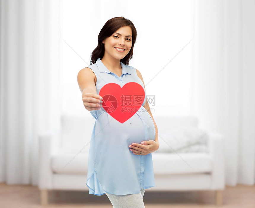 怀孕,爱,人期望的快乐的孕妇,红色的心形触摸她的肚子家里的房间背景图片