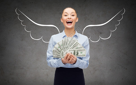 商业,金融,天投资者货币笑的女商人与美元现金翅膀灰色混凝土背景图片