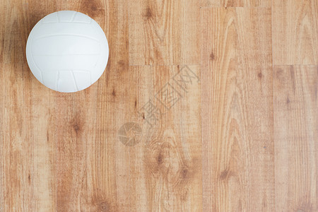 排球物体运动,健身,游戏,运动设备物体的顶部木地板上的排球球背景