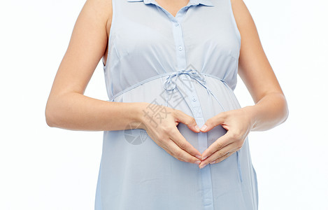 怀孕,爱,慈善,人期望密切孕妇白色背景下的腹部心脏手势图片