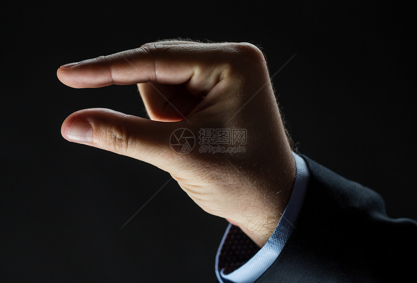 商业,人,手语手势特写商人的手小尺寸的黑色背景图片