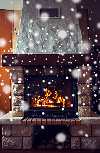 冬天,诞节,温暖,火舒适的燃烧的壁炉家里与雪图片