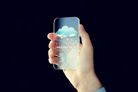 技术,应用,天气,预报人的男手持透明智能手机与云图标空气温度屏幕上的黑色背景图片