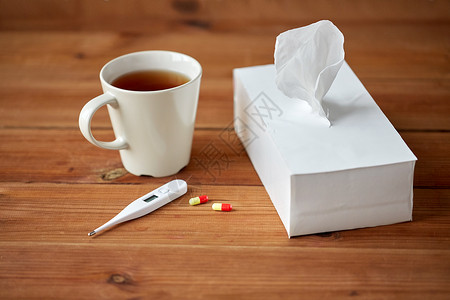 医疗保健,医学,流感治疗杯茶,纸巾温度计与药丸图片